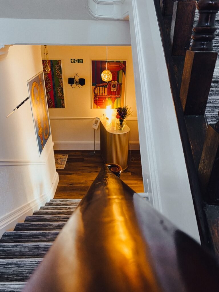 The view down the staircase to the reception are of the bishop and bison hotel.