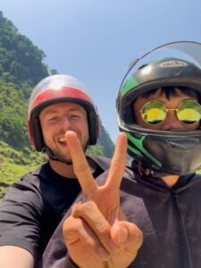 Danny on the back of his motorbike with his easy rider - Ha Giang Loop